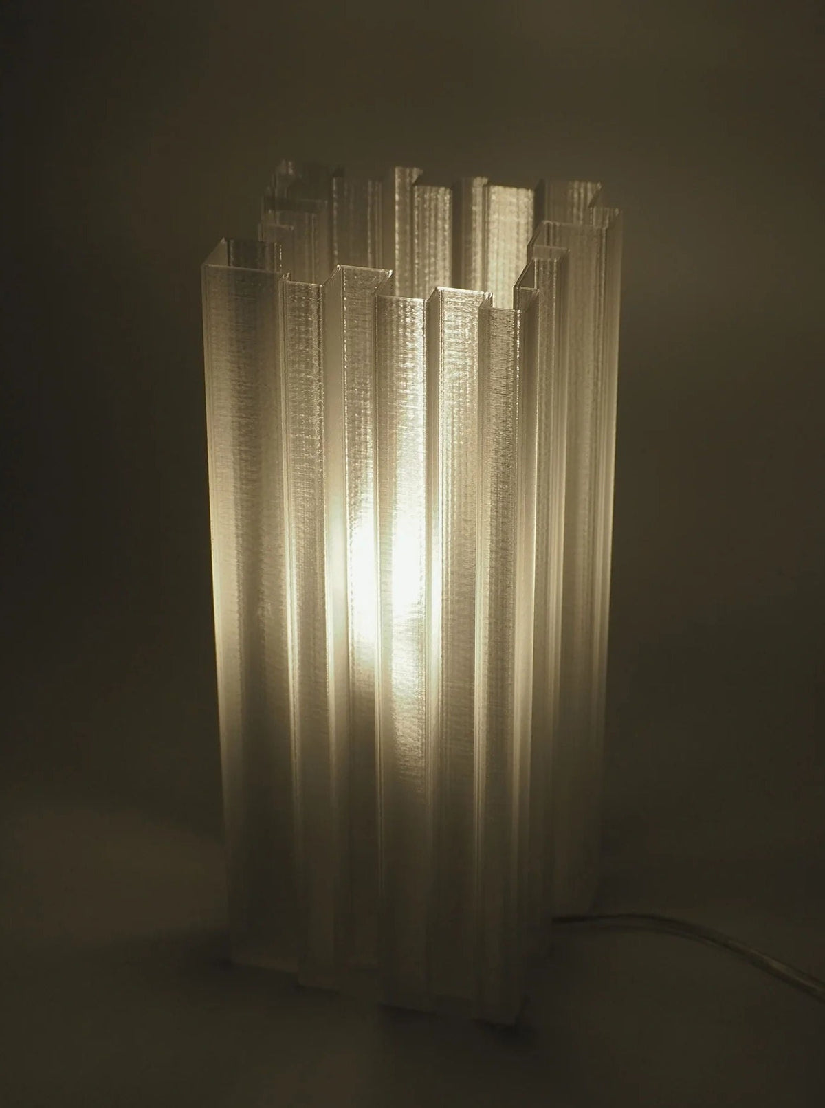  A pair of Orgue Lamps casting a warm glow in a cozy bedroom