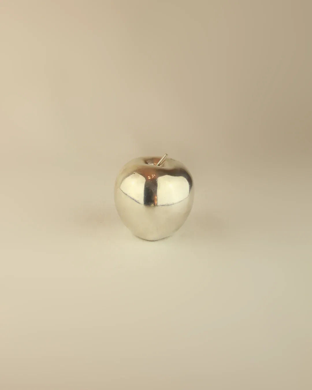  Beautiful silver apple ornament with a reflective surface and elegant design