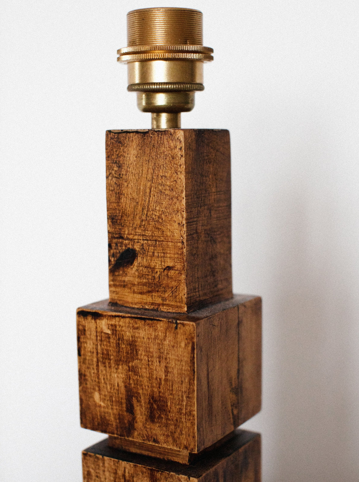 Vintage-style wooden table lamp with intricate detailing and warm glow