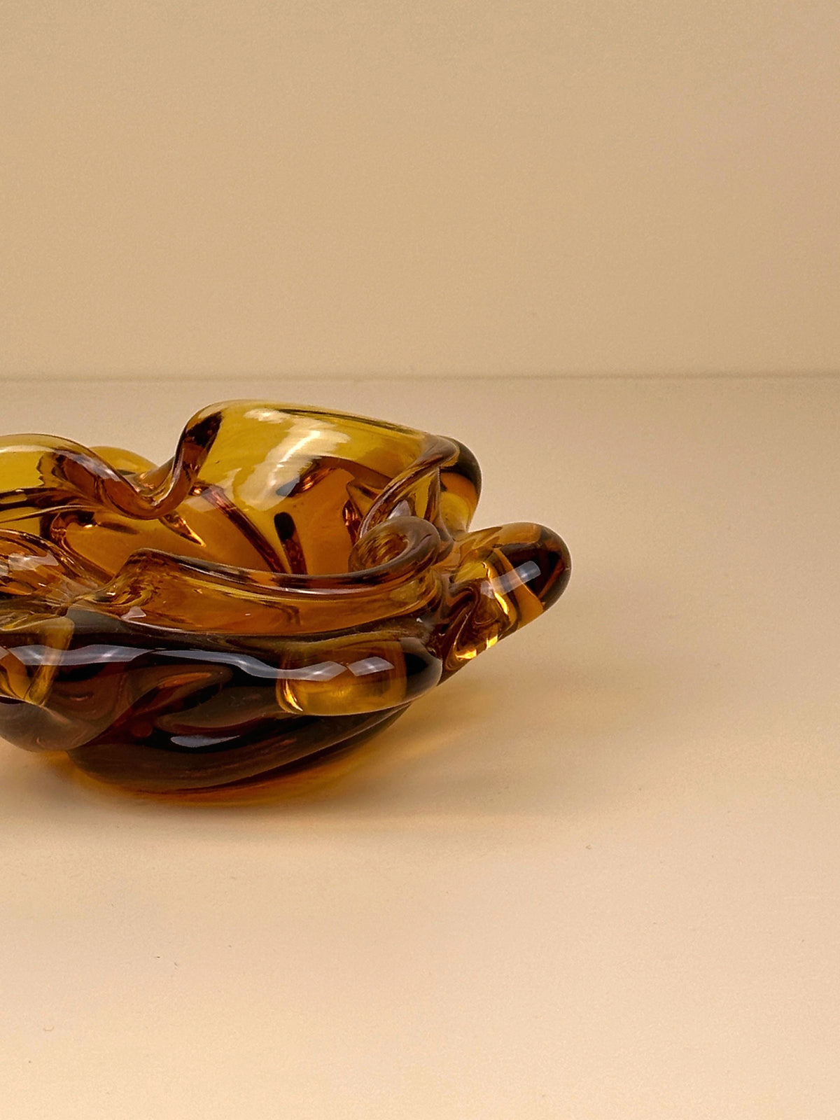  Handcrafted 70s Bohemian ashtray in a warm amber hue, perfect for adding a touch of nostalgia to any space