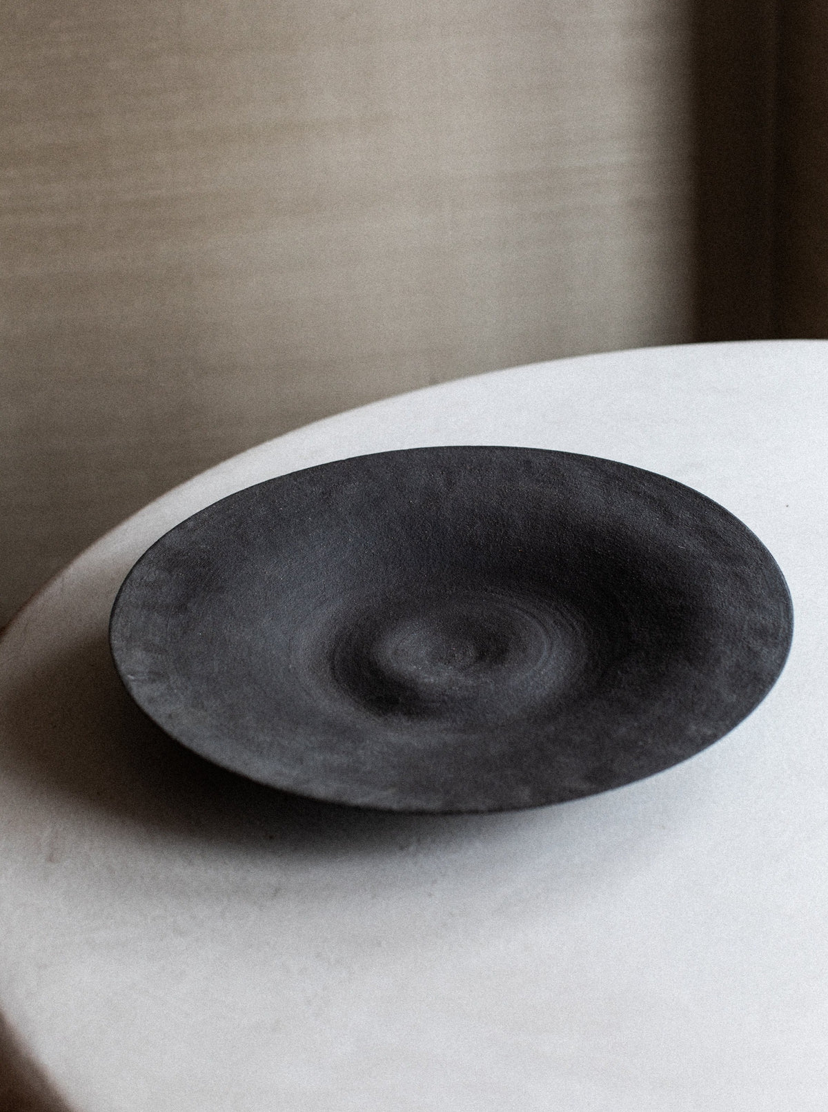Artistic bowl made from reclaimed wood with a natural, organic shape
