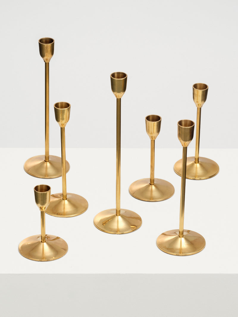 Set of 3 brass candleholders with intricate geometric design and smooth finish