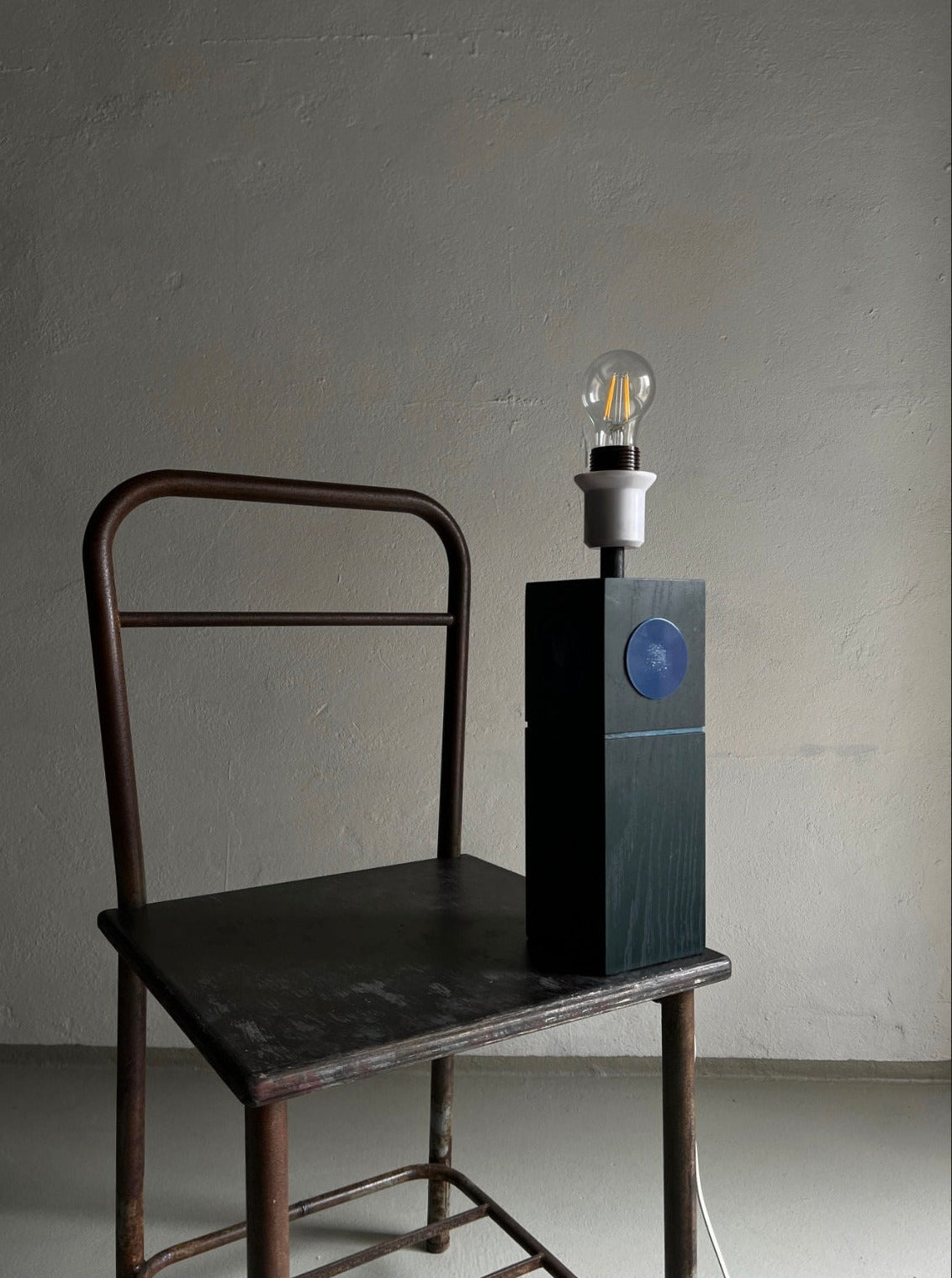 Modern black table lamp designed by Lars-Goran Nilsson with adjustable arm and sleek metal base
