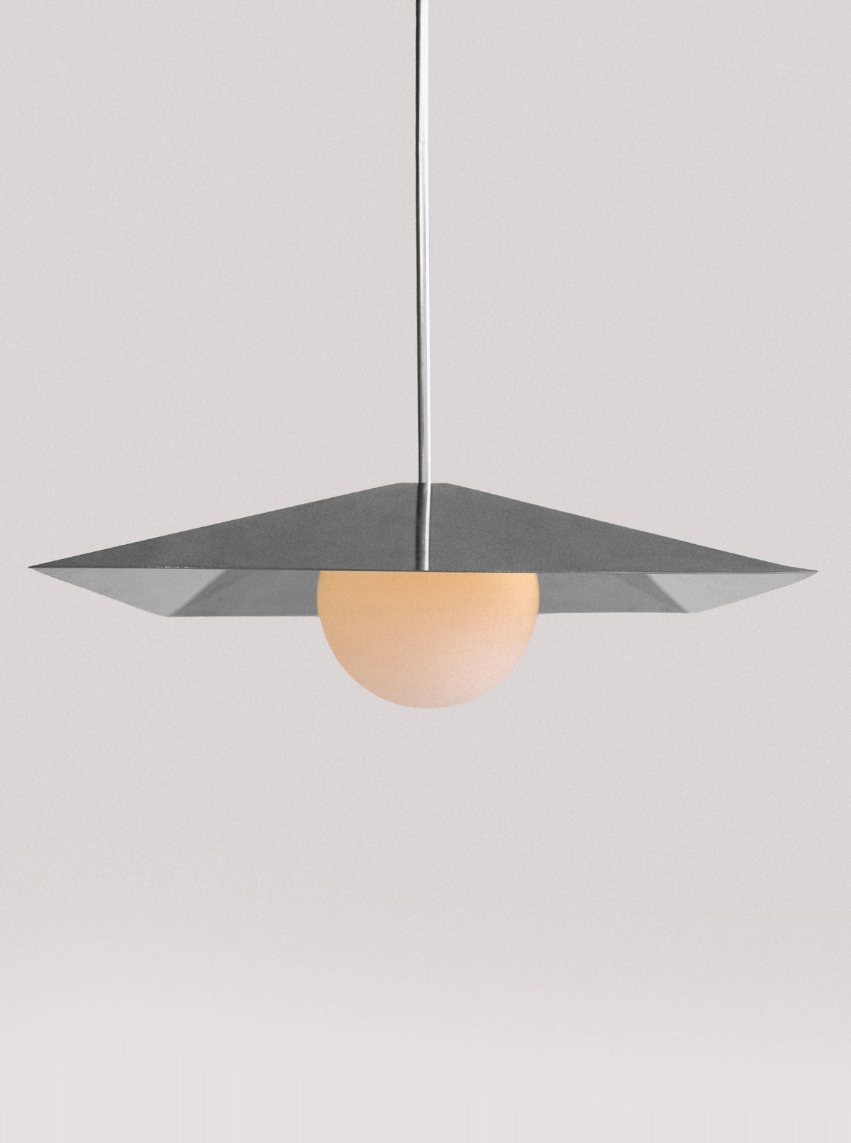  Sleek and stylish 120 Large Pendant lighting fixture illuminating a cozy living room with a comfortable sofa and vibrant decor